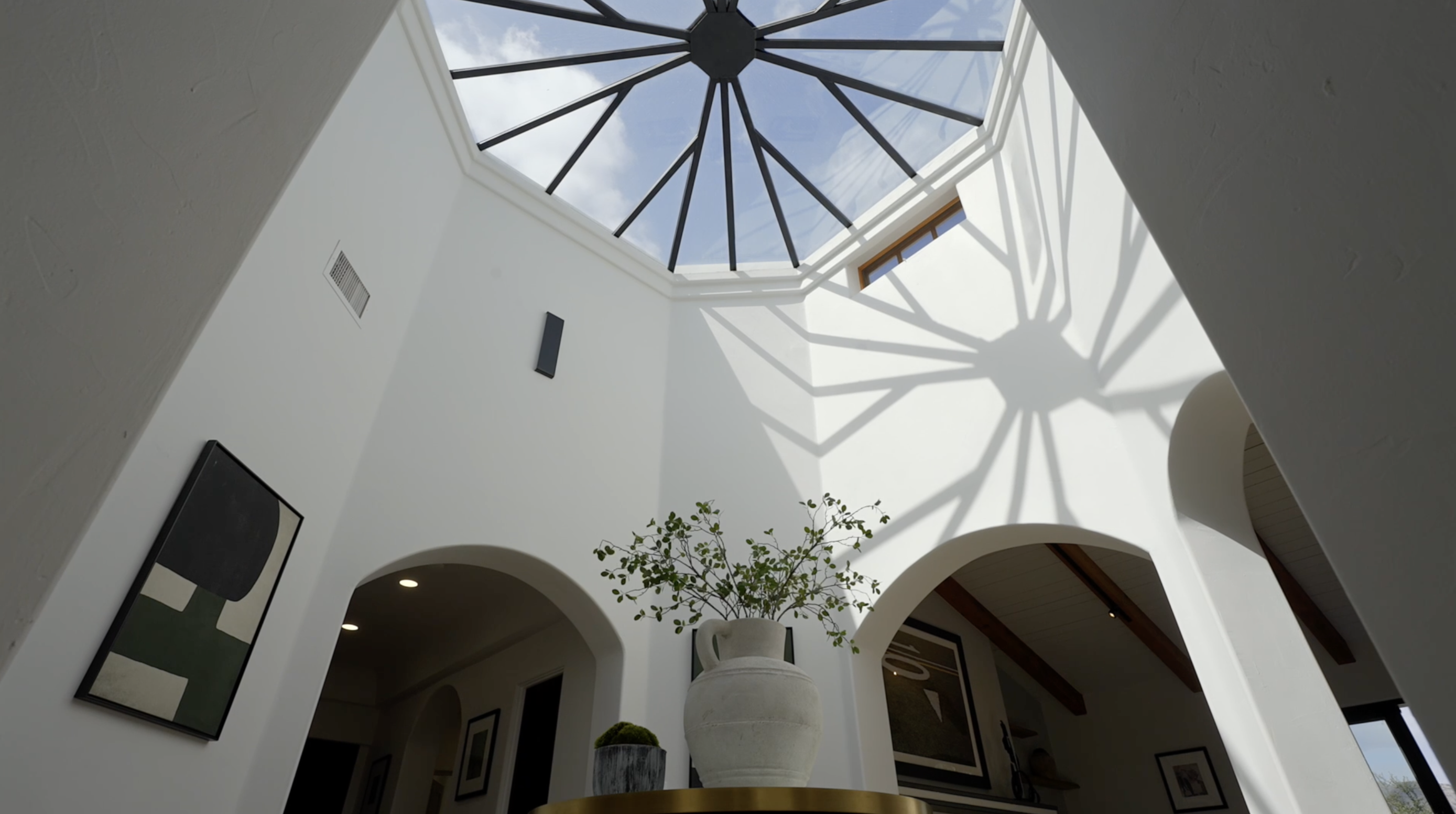 Sunlit architectural atrium with a geometric skylight