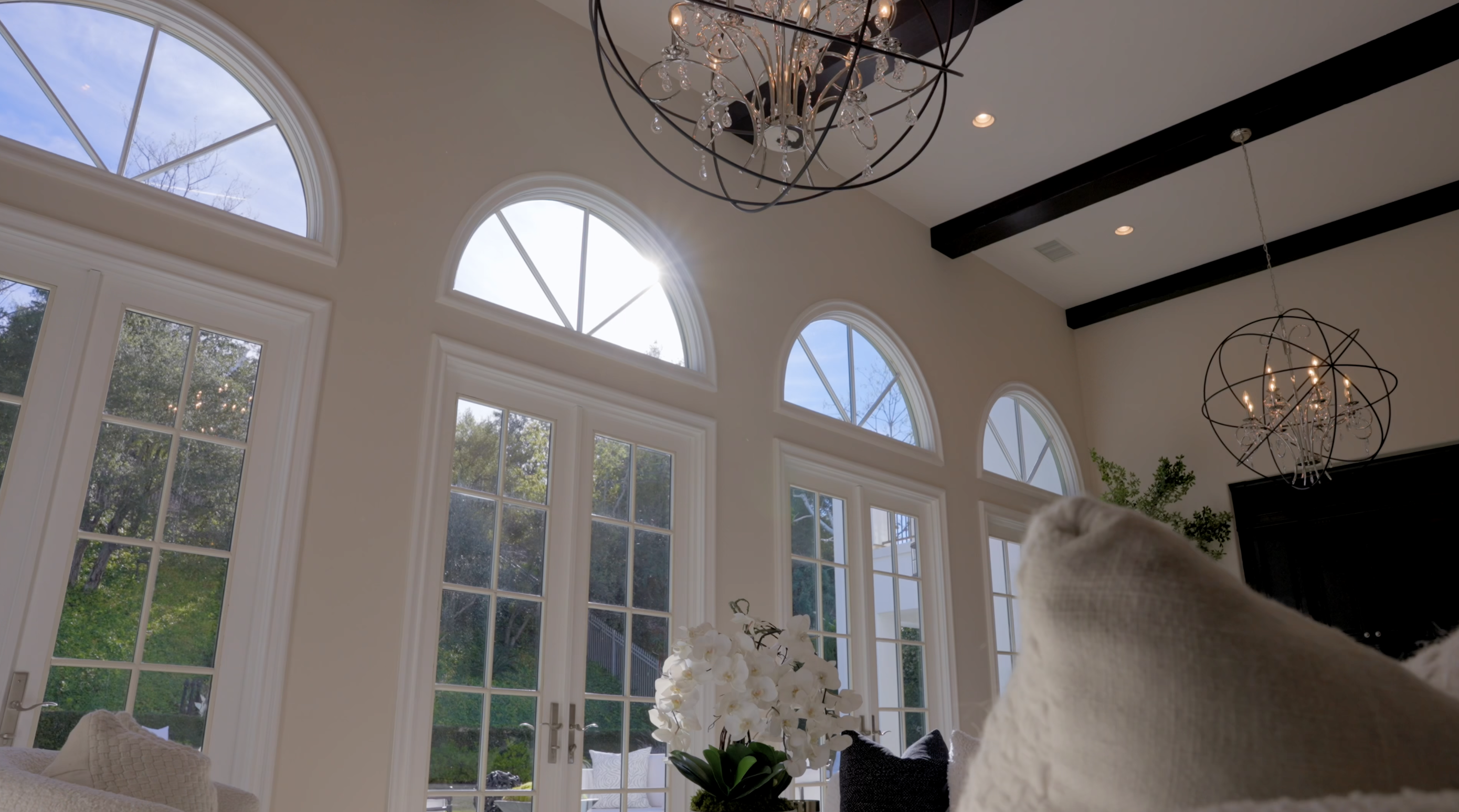 Bright architectural interior with tall windows